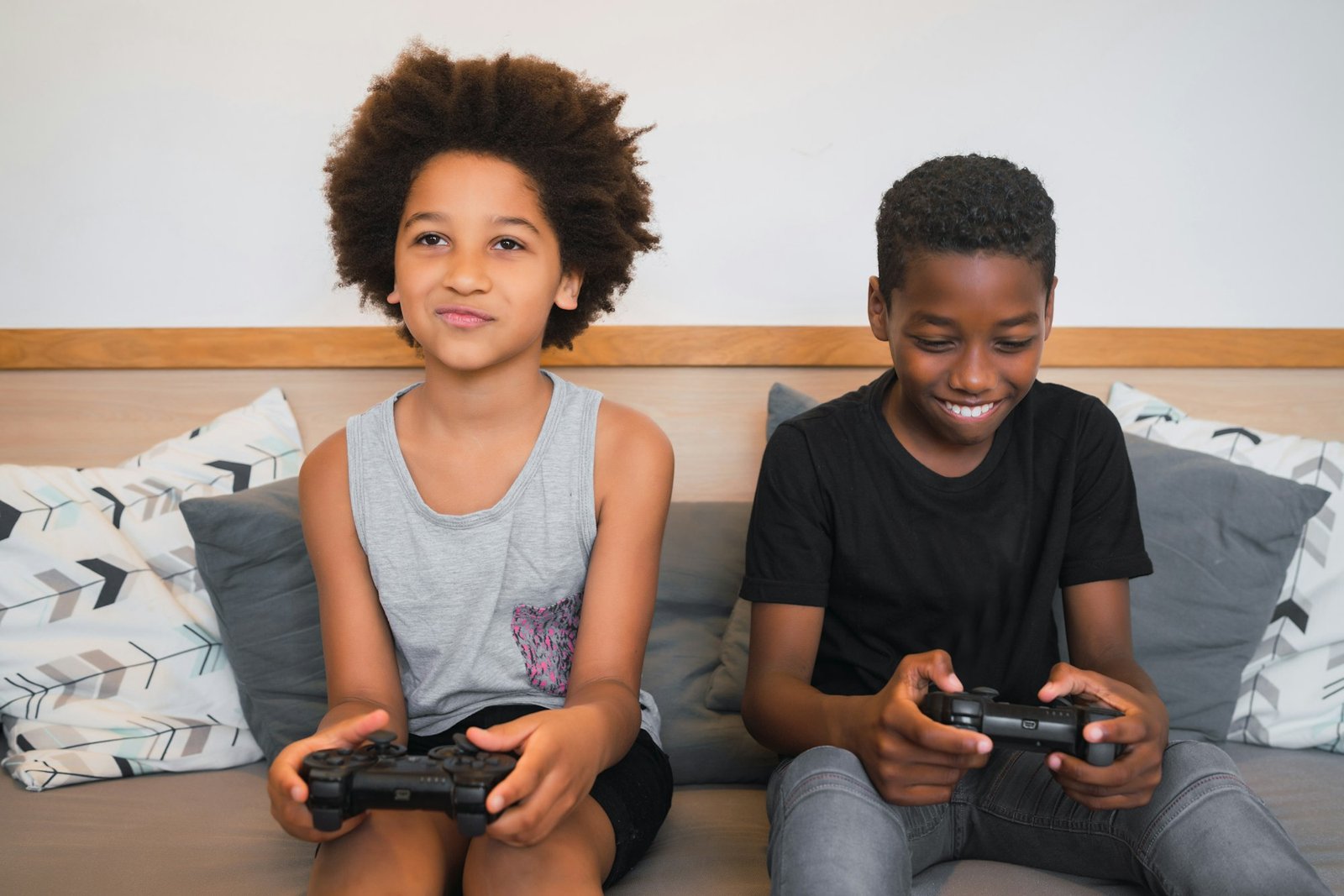 Two brothers playing video games at home.